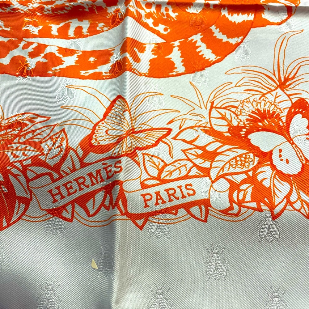 Beautiful Hermes silk scarf. New, never worn, in box.  White/orange.